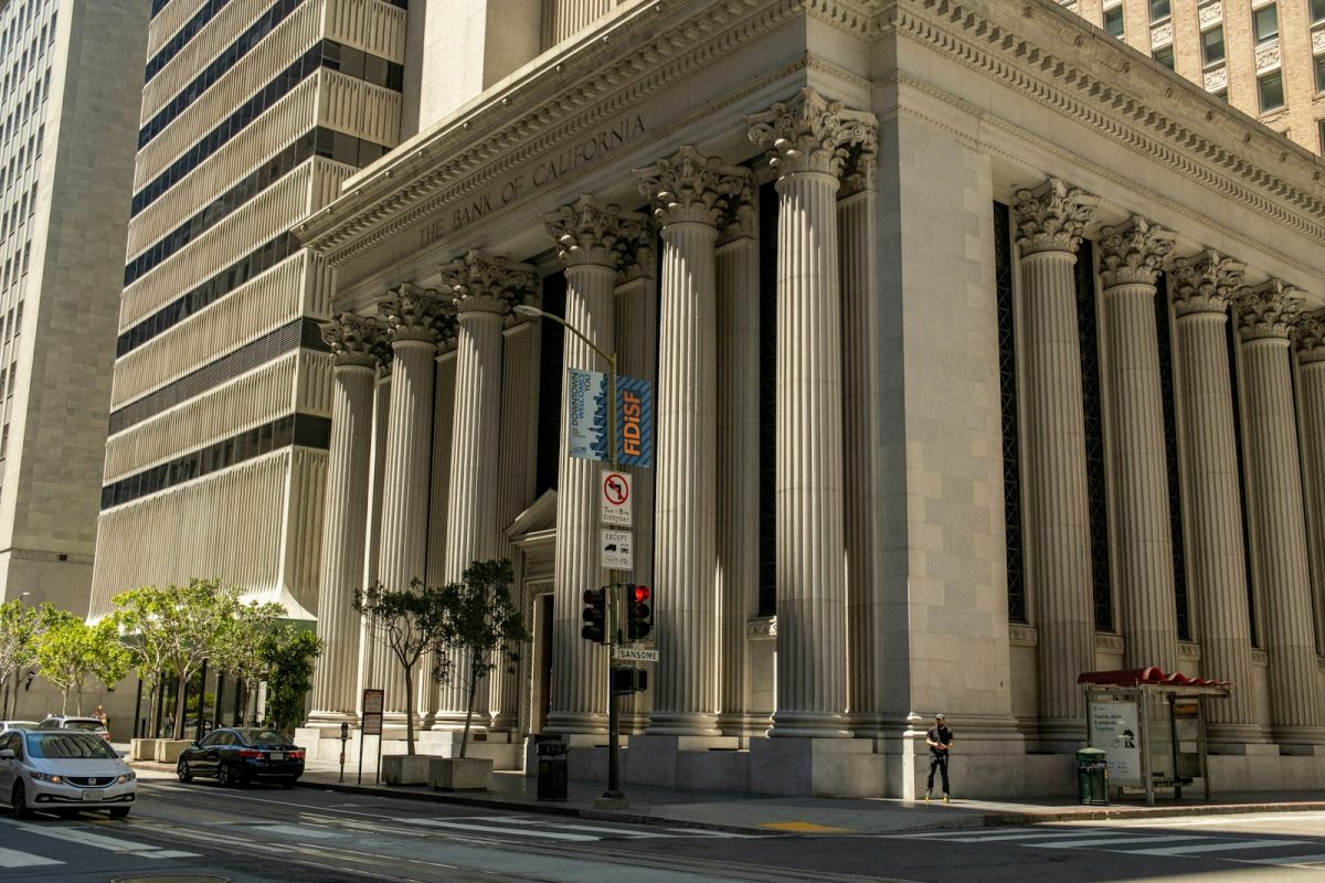 A columned bank building on a city street