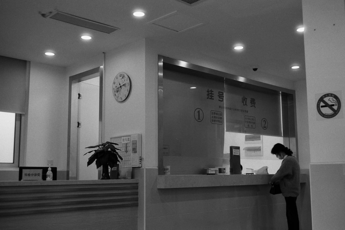 A customer standing at a service counter